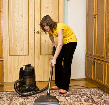 Woman with vacuum cleaner